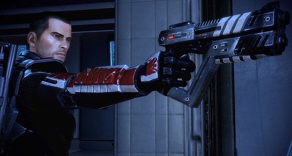 Commander Shepard pointing a gun in 