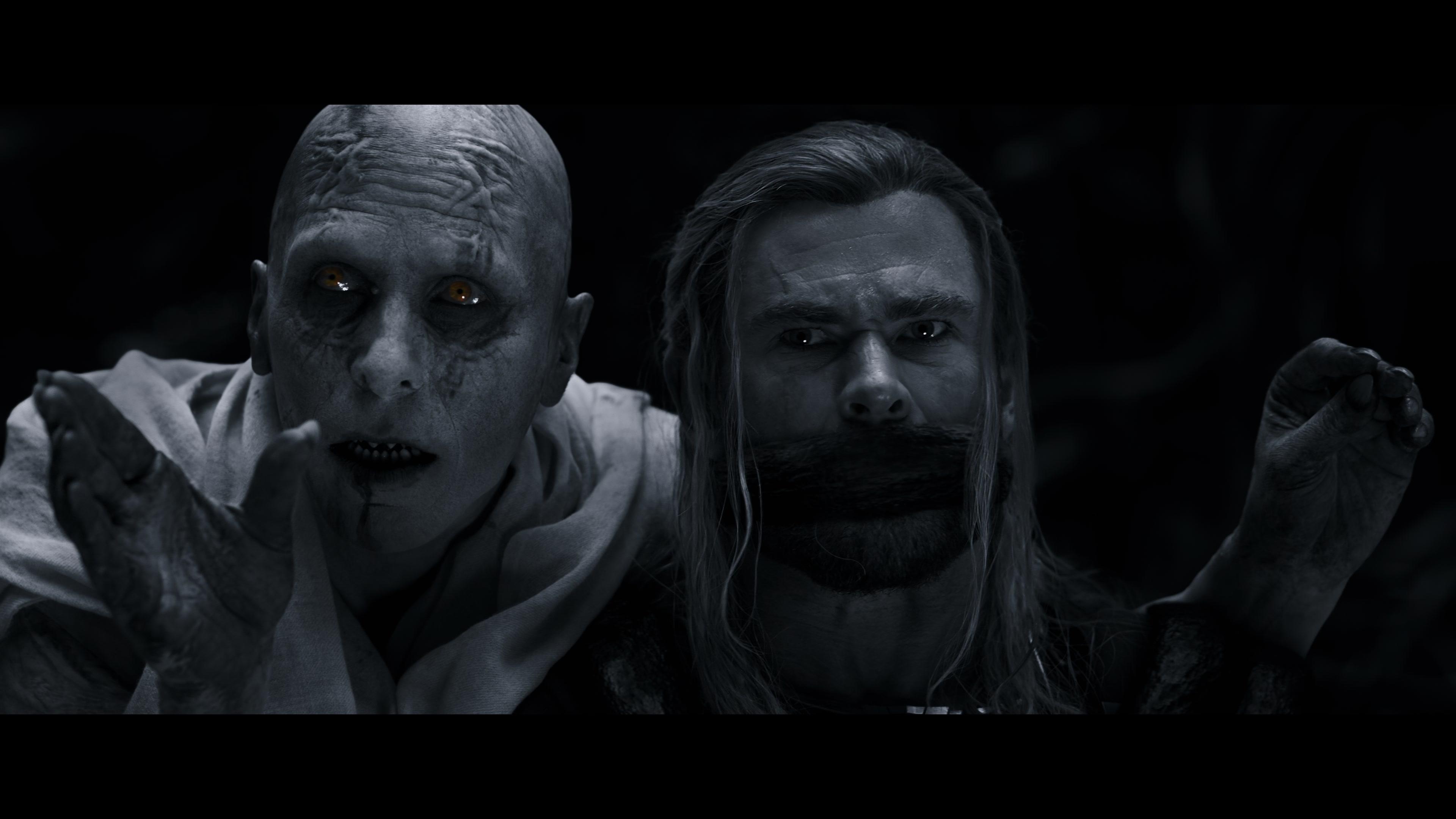 Gorr (Christian Bale) has Thor (Chris Hemsworth) in his clutches in Thor: Love and Thunder (2022), Marvel Entertainment