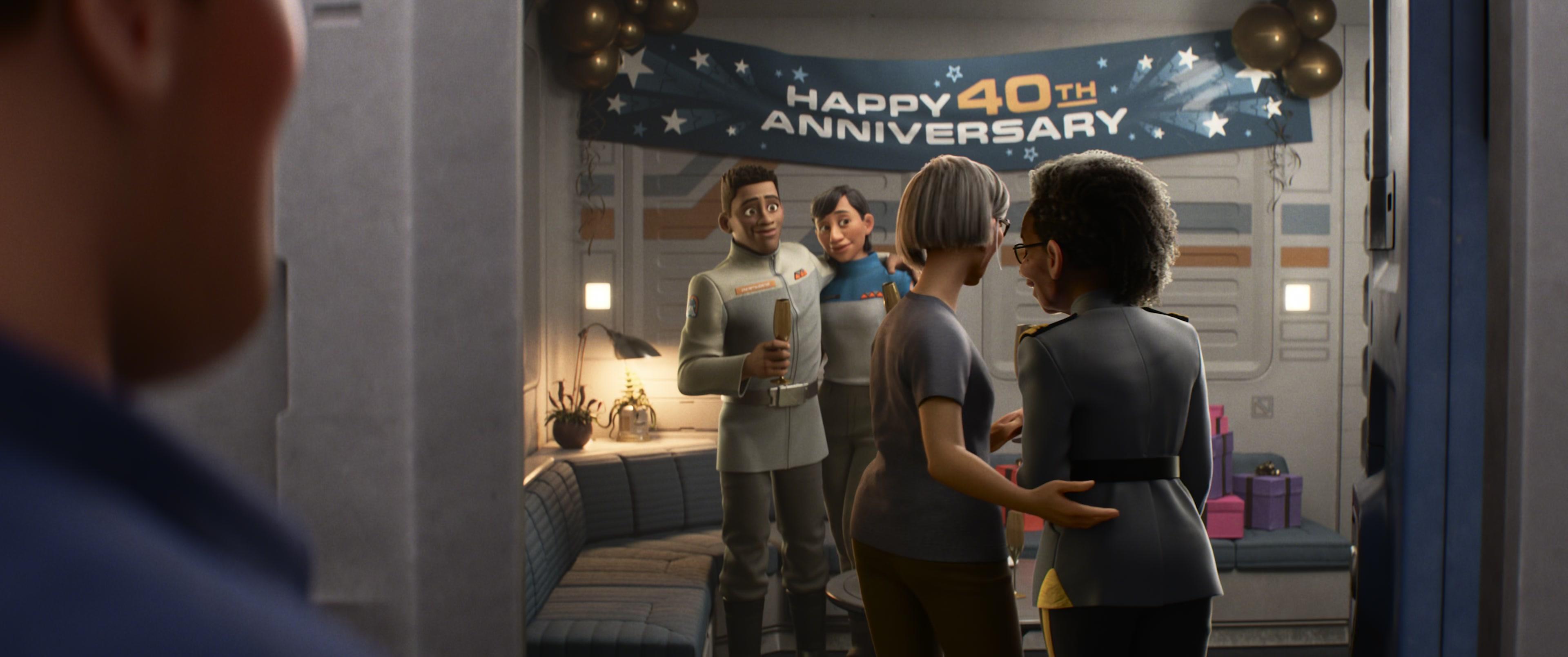 Alisha (Uzo Aduba) and Kiko (N/A) share a quick kiss in celebration of their 40th anniversary in Lightyear, Pixar Animation Studios (2022)