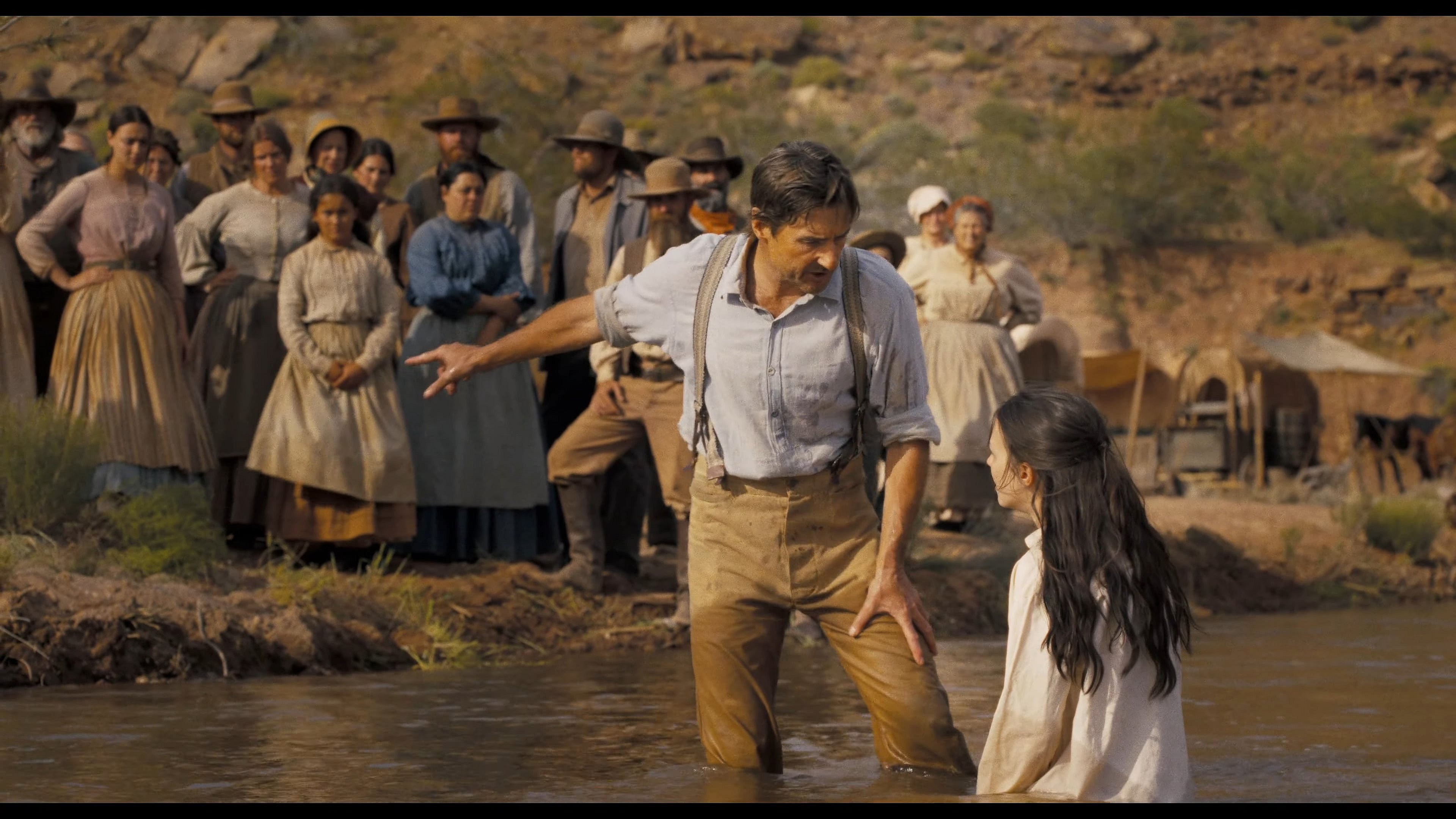 A settler (Luke Wilson) attempts to show one of his followers the light of God in Horizon: An American Saga (2024), New Line Cinema