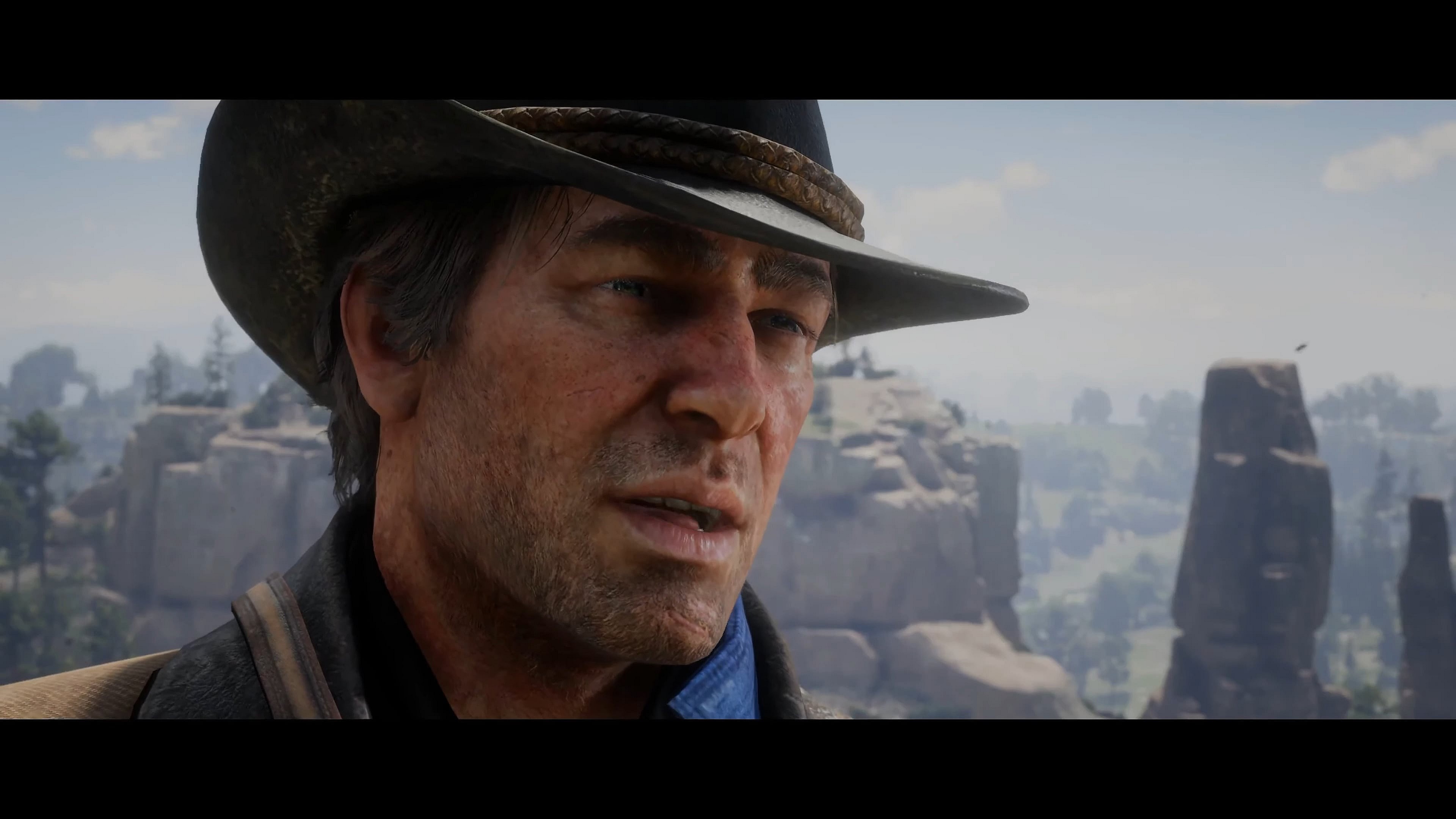 Arthur Morgan (Roger Clark) attempts to dissuade Jimmy Brooks (Adam McNulty) from reporting his presence to the authorities in Red Dead Redemption 2 (2018), Rockstar Studios