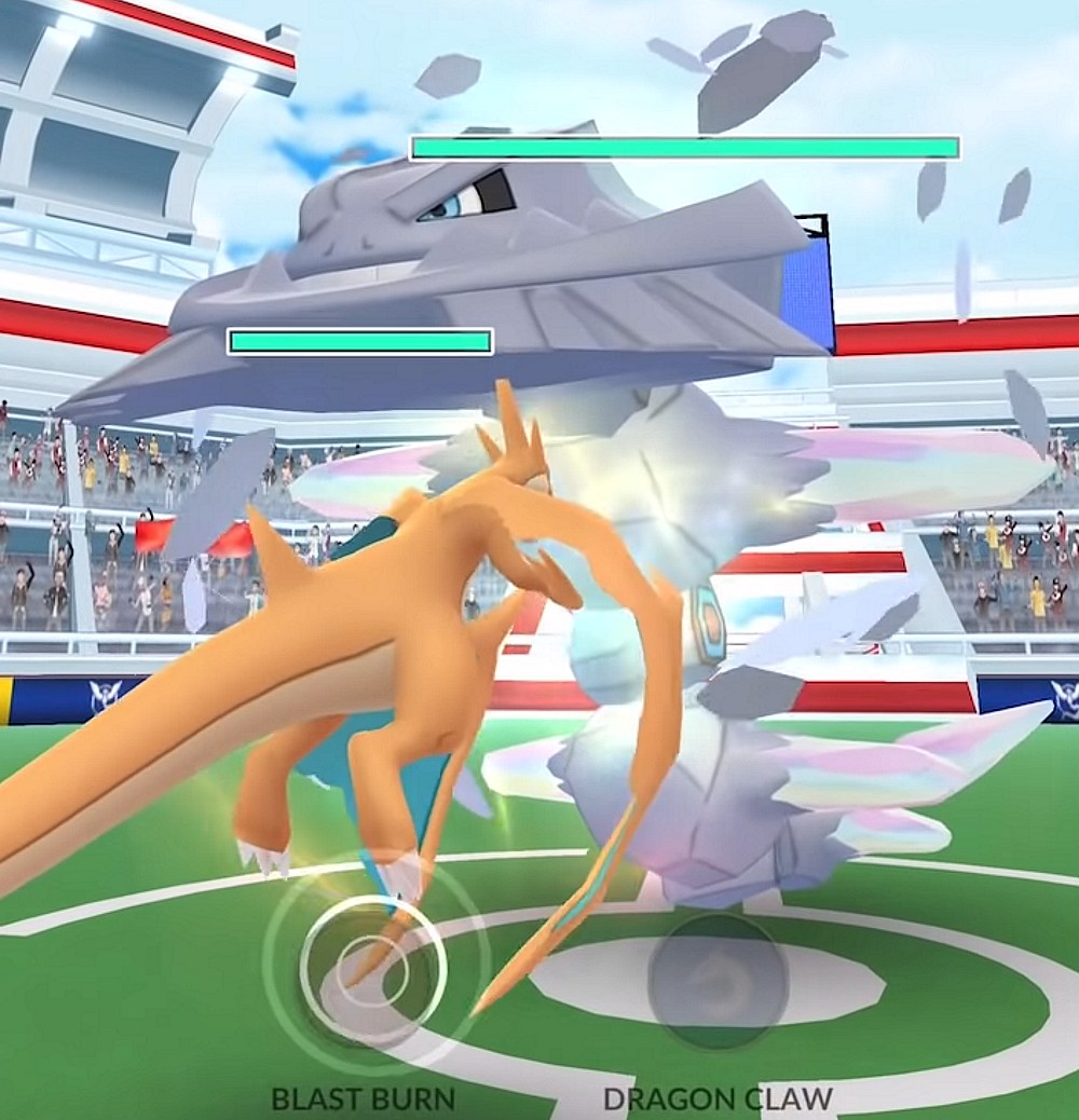 A Mega Charizard Y faces off against a Mega Steelix in a Mega Raid via Pokémon GO (2016), Niantic