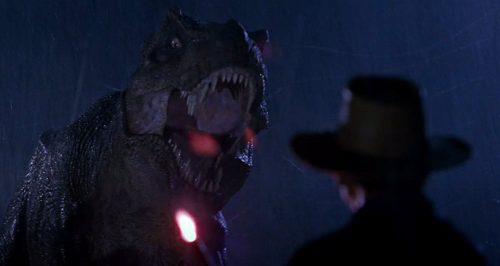 The T-Rex intimidates Dr. Grant (Sam Neill) in 'Jurassic Park' (1993), Universal Pictures