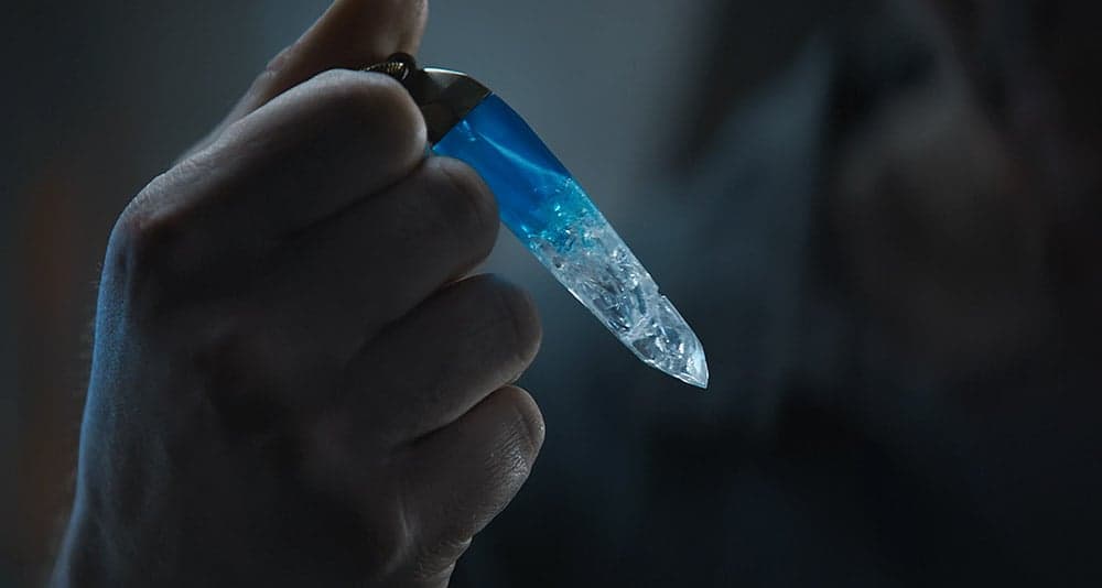 Cassian holds a kyber crystal in Star Wars: Andor, Disney+