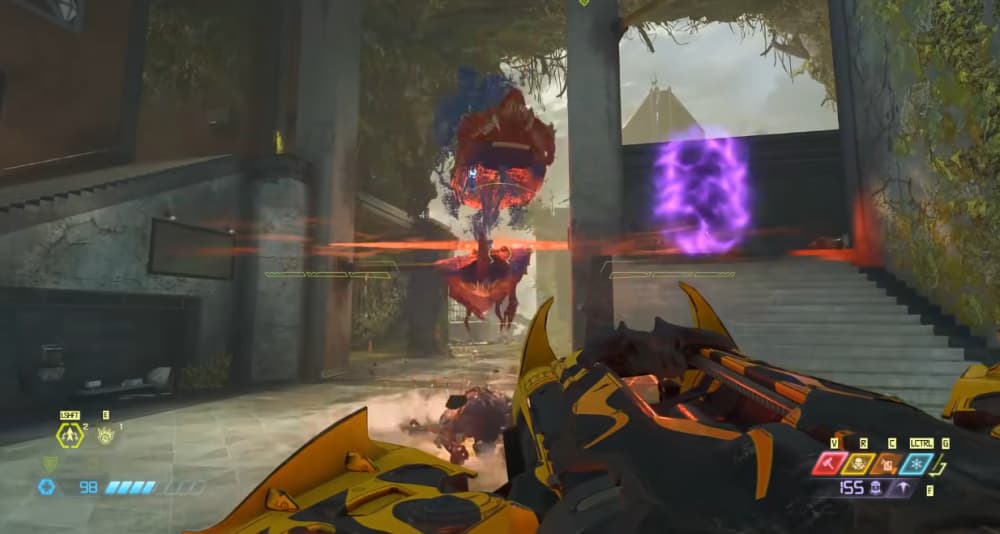 A Cacodemon is sliced in half by the Ballista's destroyer blade via Doom Eternal (2020), Bethesda Softworks