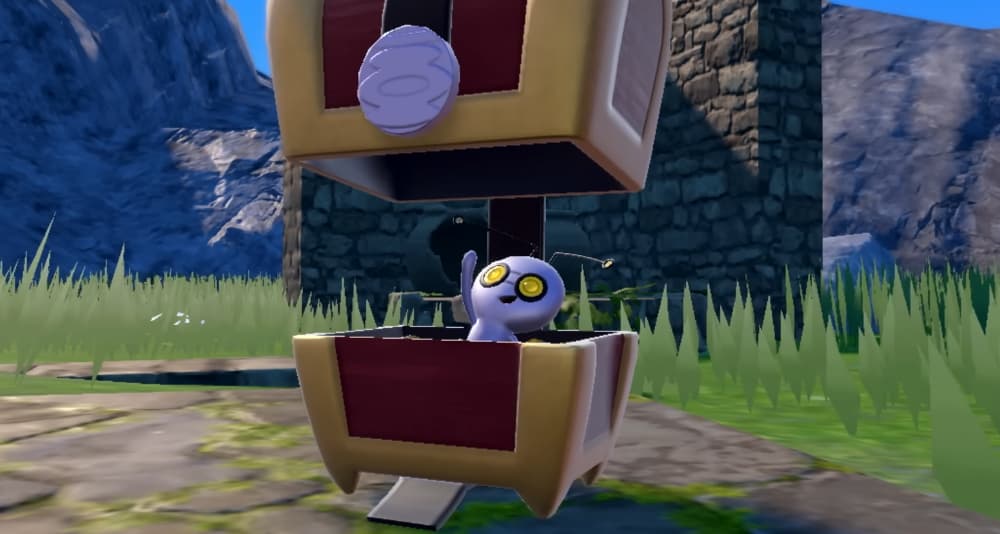 A Gimmighoul waves from inside its chest via Pokémon Scarlet & Violet (2022), Nintendo