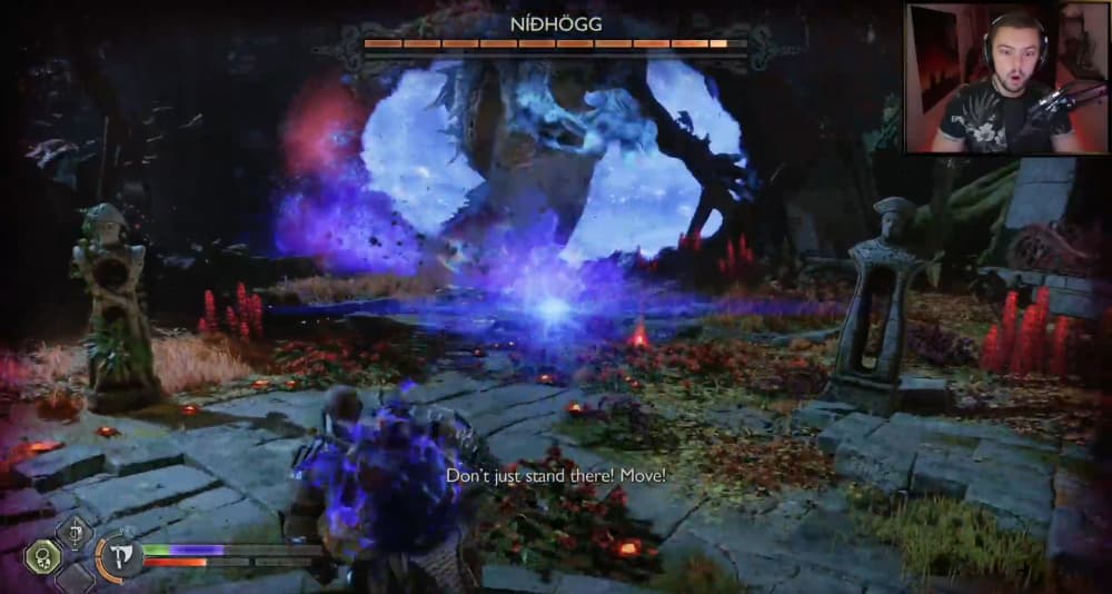 Twitch Streamer Elajjaz despairs as NPCs continue to blurt advise during the Nidhögg boss battle via God of War Ragnarök (2022), Sony Interactive Entertainment