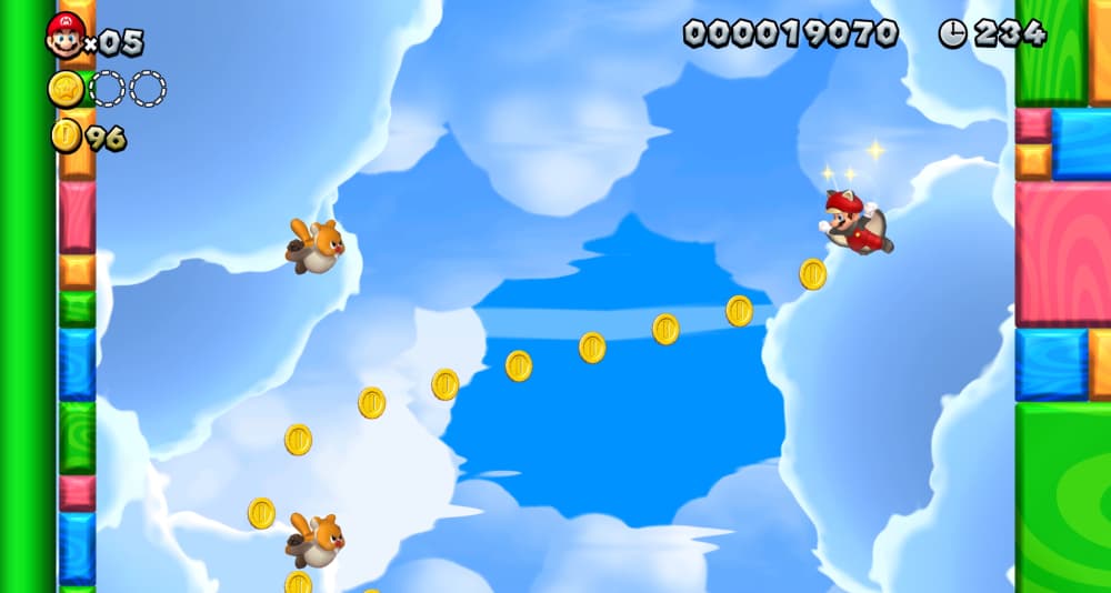 Mario soars through the clouds as Flying Squirrel Mario between coins and Waddlewings via New Super Mario Bros. Deluxe (2019), Nintendo
