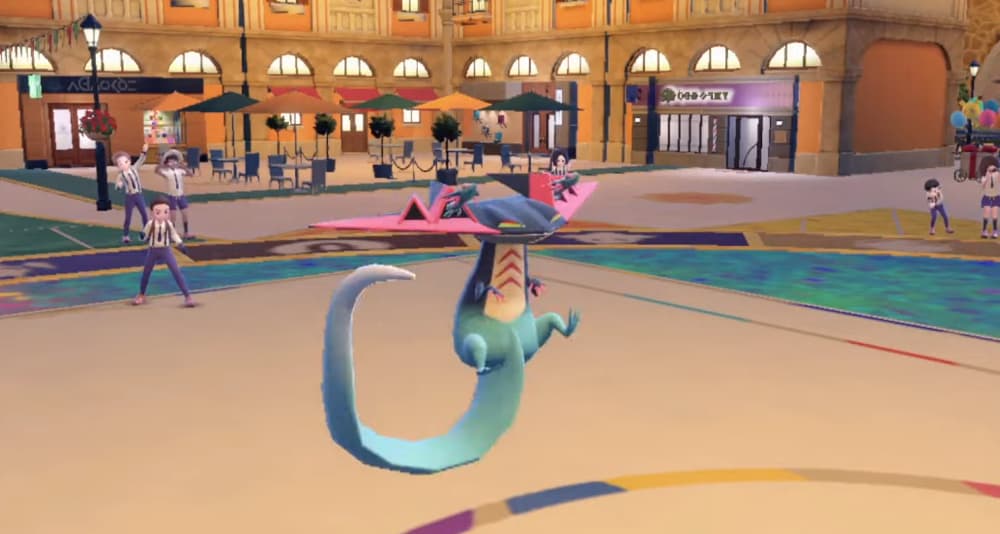 A trainer cheers on its Dragapult battling in the center of Mesagoza via Pokémon Scarlet & Violet (2022), Nintendo
