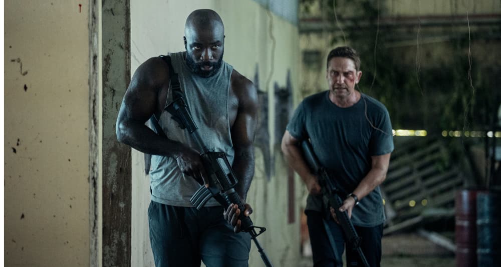 Mike Colter as Louis Gaspare and Gerard Butler as Brodie Torrance in Plane. Photo Credit: Kenneth Rexach