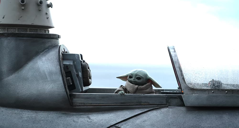 Grogu and an R5 droid in a customized Naboo starfighter in 'The Mandalorian' (2023), Disney+