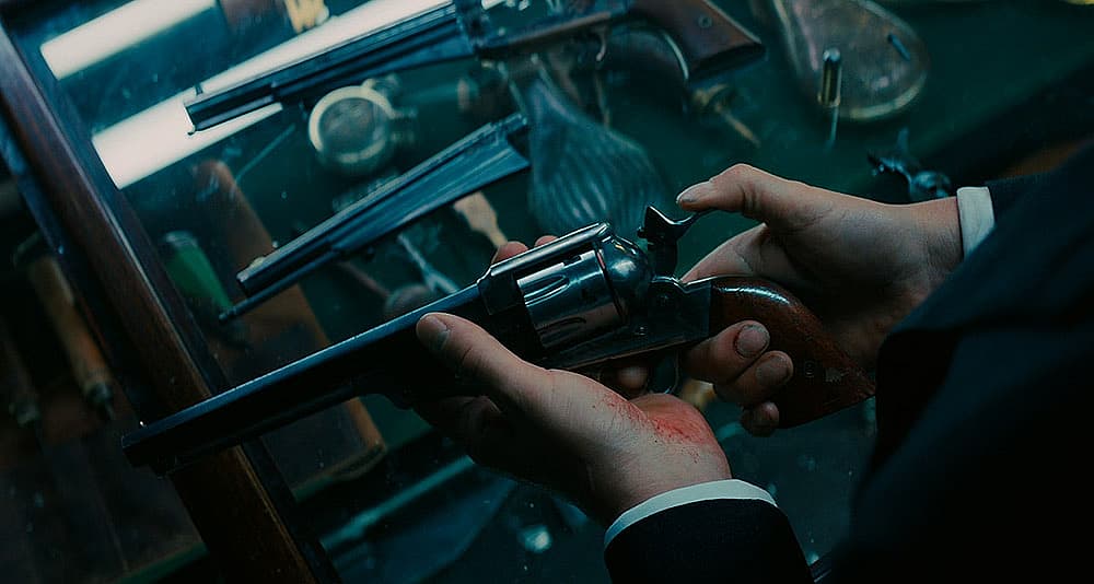 John cobbles together a makeshift Frankenstein revolver in John Wick 3: Parabellum (2019), Lionsgate