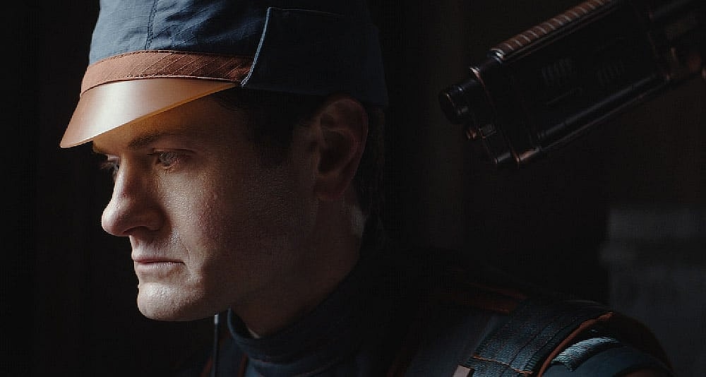 A security officer held up by Cassian in Star Wars: Andor, Disney+