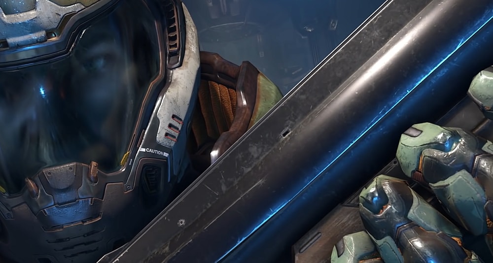 The Doomslayer holds his combat shotgun aloft via Doom Eternal (2020), Bethesda Softworks