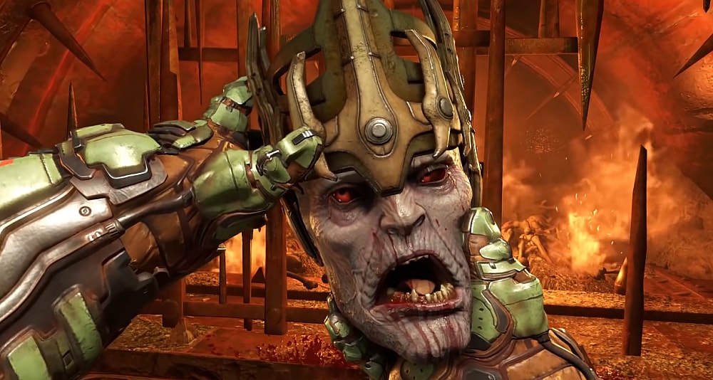 The Doomslayer holds up Hell Priest Deag Nilox' decapitated head, fixing his crown via Doom Eternal (2020), Bethesda Softworks