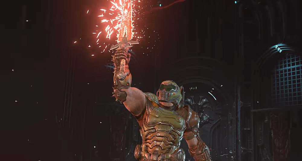 The Doomslayer holds the Crucible aloft via Doom Eternal (2020), Bethesda Softworks