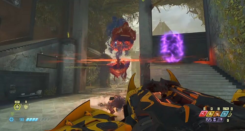 A Cacodemon is sliced in half by the Ballista's destroyer blade via Doom Eternal (2020), Bethesda Softworks