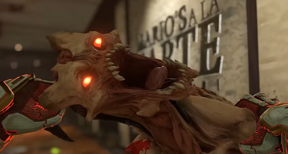 The Doomslayer pulls a Whiplash's head apart with his bare hands in a glory kill via Doom Eternal (2020), Bethesda Softworks