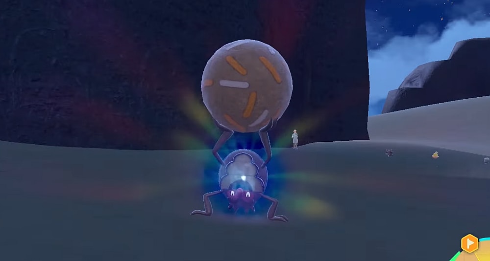 Rellor holds its mud ball aloft as it begins to evolve via Pokémon Scarlet & Violet (2022), Nintendo