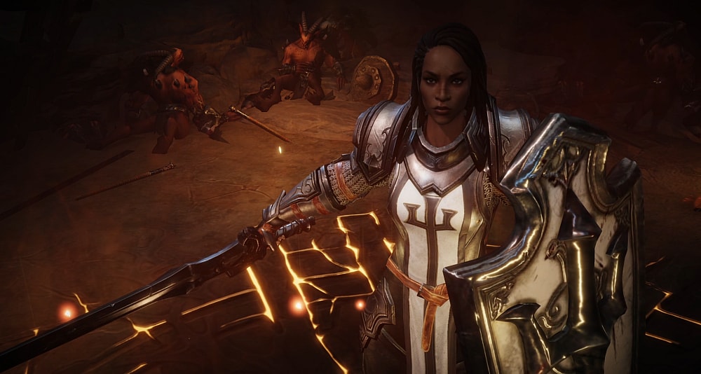 A female Crusader stands before felled demons A crusader fights against a giant demon via Diablo Immortal (2022), Blizzard Entertainment