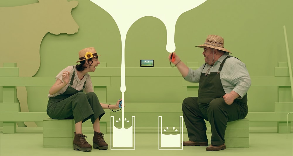 A man and a woman milk a virtual cow via 1-2-Switch (2017), Nintendo