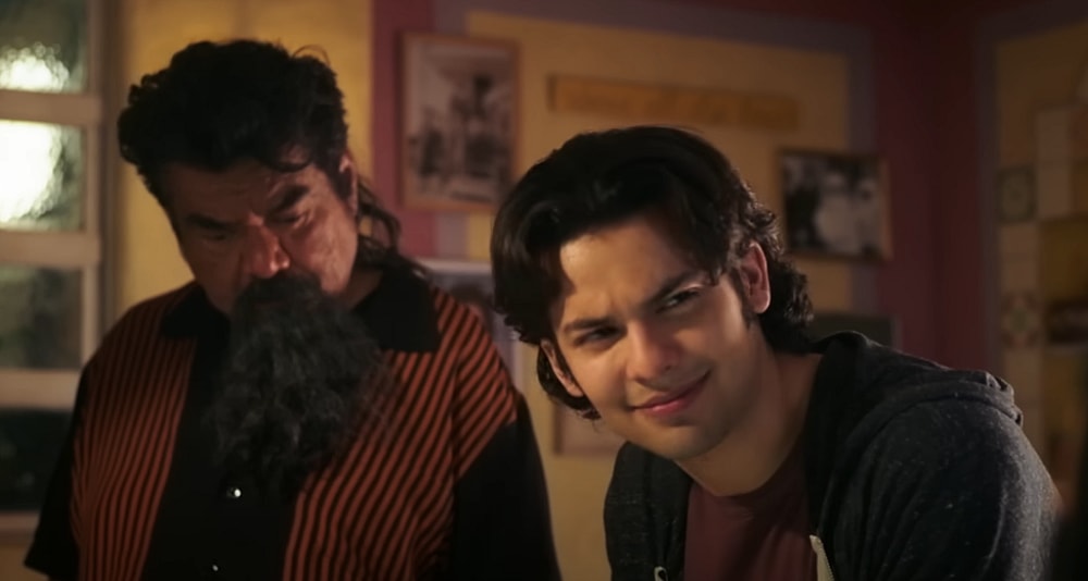 George Lopez as Uncle Rudy and Xolo Maridueña as Jaime Reyes in Blue Beetle (2023), DC Studios