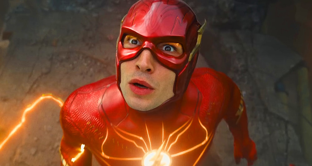 Barry Allen (Ezra Miller) watches as a hospital collapses in The Flash (2023), Warner Bros. Pictures