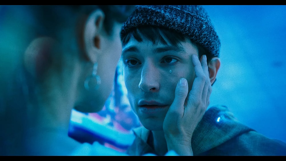 Barry Allen (Ezra Miller) says good-bye to his mother Nora (Maribel Verdú) in The Flash (2023), Warner Bros. Discovery