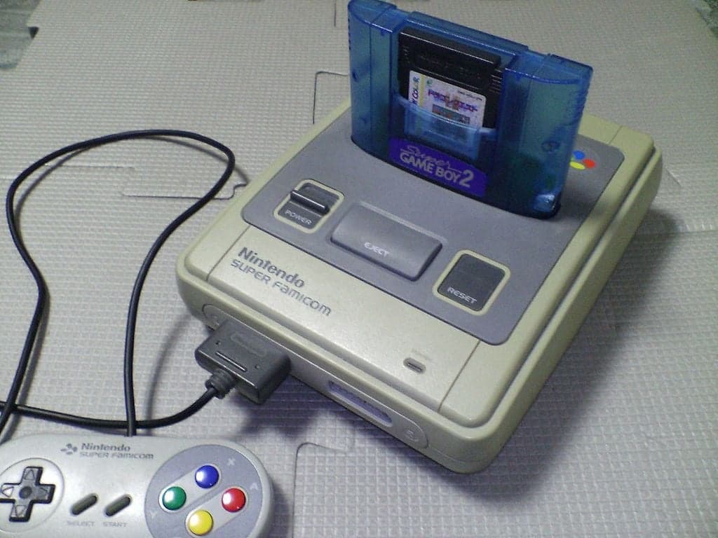A GameBoy cartridge inserted into a Super GB and being played on a SNES. Via PiaCarrot, Wikipedia.