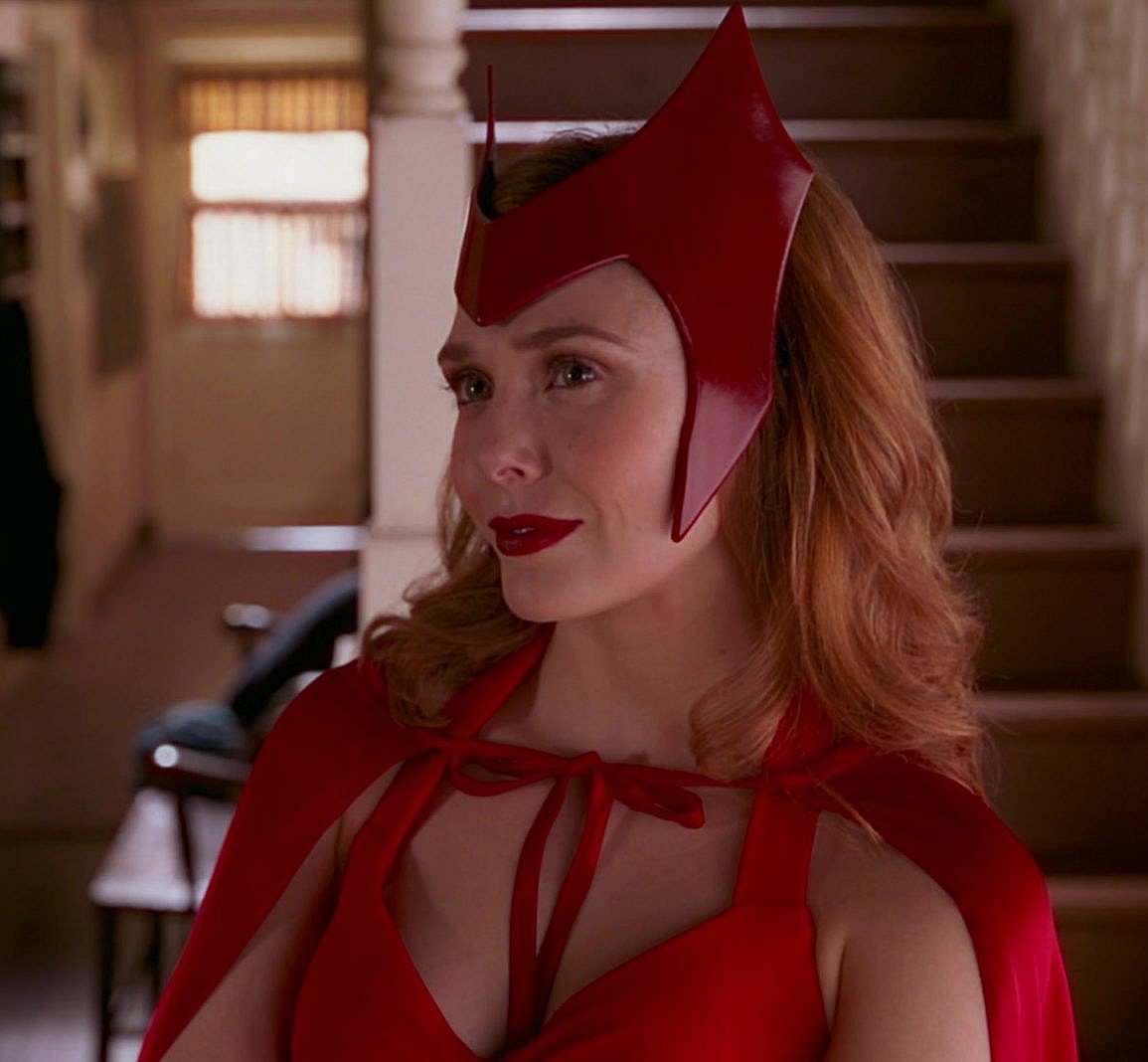 Wanda Maximoff (Elizabeth Olsen) dons her classic comic book costume in WandaVision Season 1 Episode 6 "All-New Halloween Spooktacular!" (2021), Marvel Entertainment