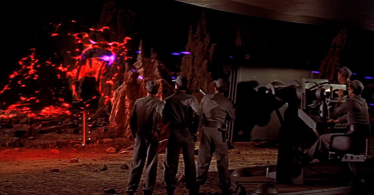 The crew battles a terrifying Id monster in Forbidden Planet (1956), Metro-Goldwyn-Mayer