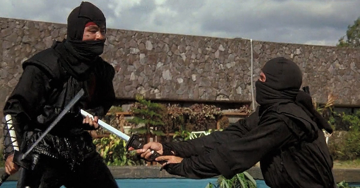 Joe (Michael Dudikoff) slays the Black Star Ninja (Tadashi Yamashita) in American Ninja (1985), Cannon Group