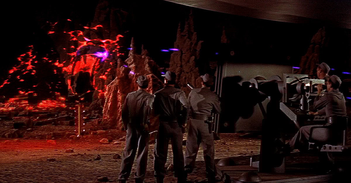 The crew battles a terrifying Id monster in Forbidden Planet (1956), Metro-Goldwyn-Mayer