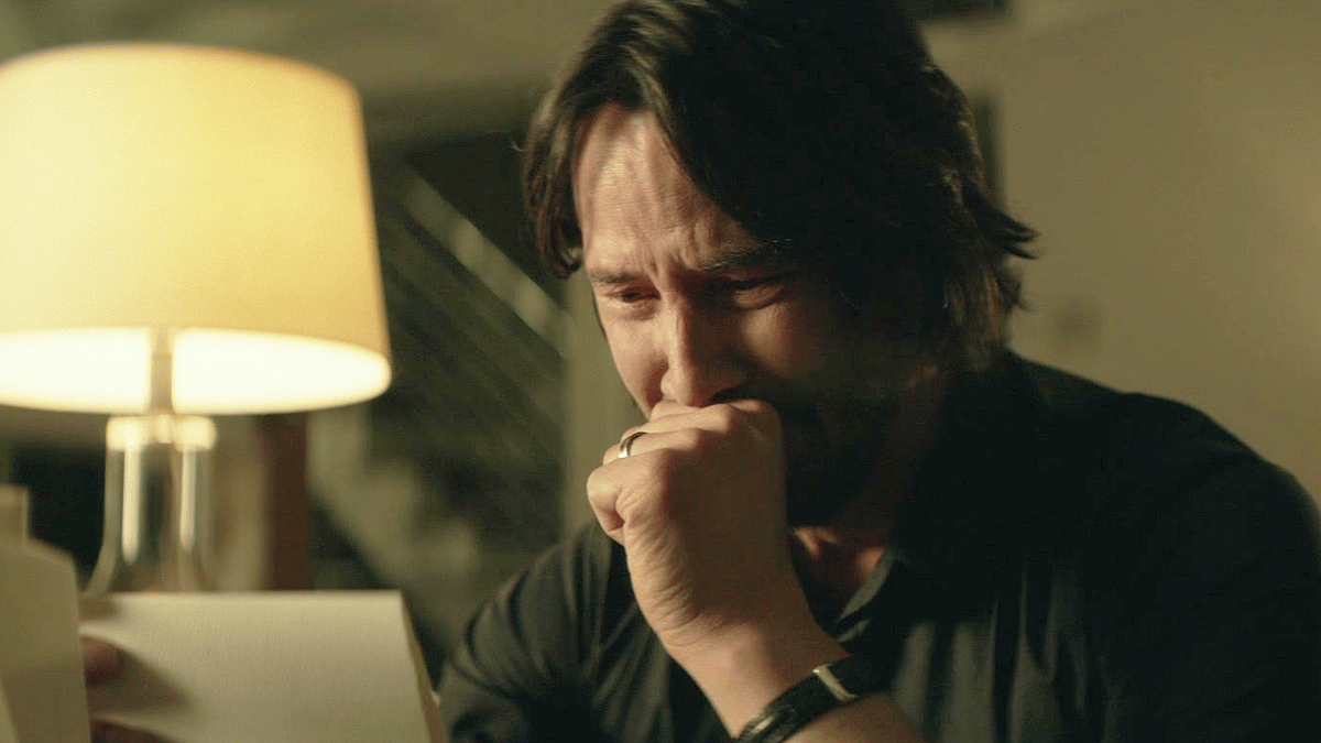 John Wick (Keanu Reeves) receives a parting gift from his late wife Helen (Bridget Moynahan) in John Wick (2014), Lionsgate