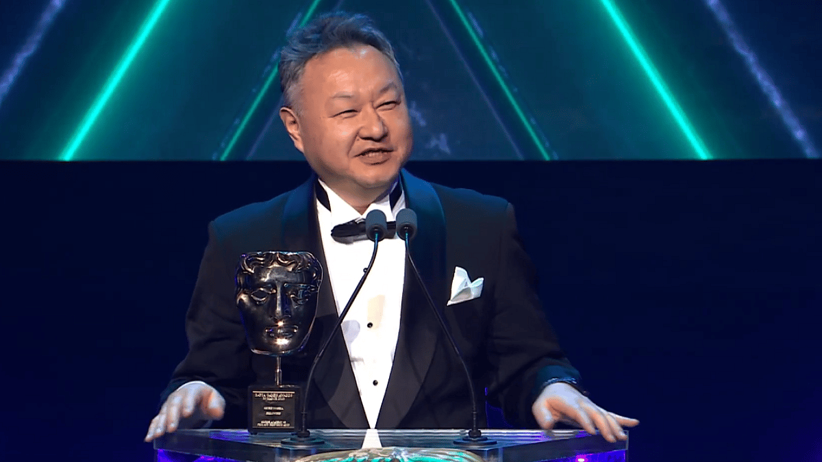 Shuhei Yoshida collects his fellowship award during the 2023 Bafta Awards