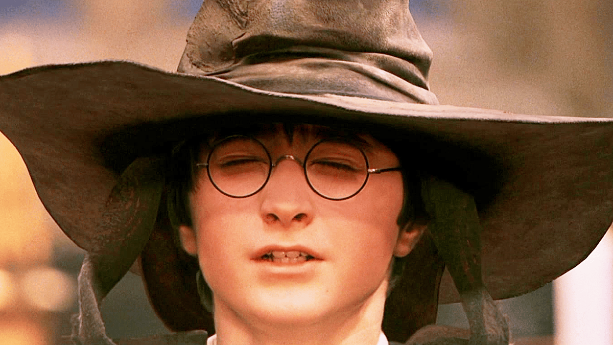 Harry (Daniel Radcliffe) awaits his placement from the Sorting Hat (Leslie Phillips) in Harry Potter and the Philosopher's Stone (2001), Warner Bros. Pictures