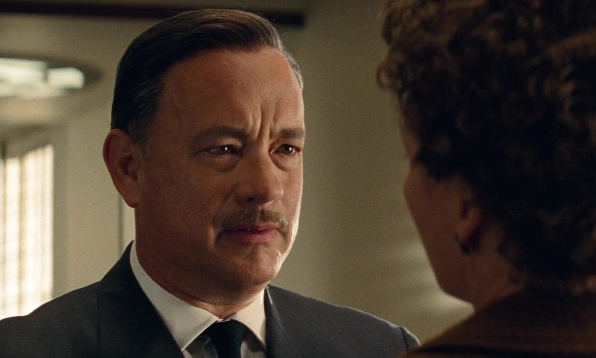 Walt Disney (Tom Hanks) introduces himself to Mary Poppins author P.L. Travers (Emma Thompson) in Saving Mr. Banks (2013), Disney