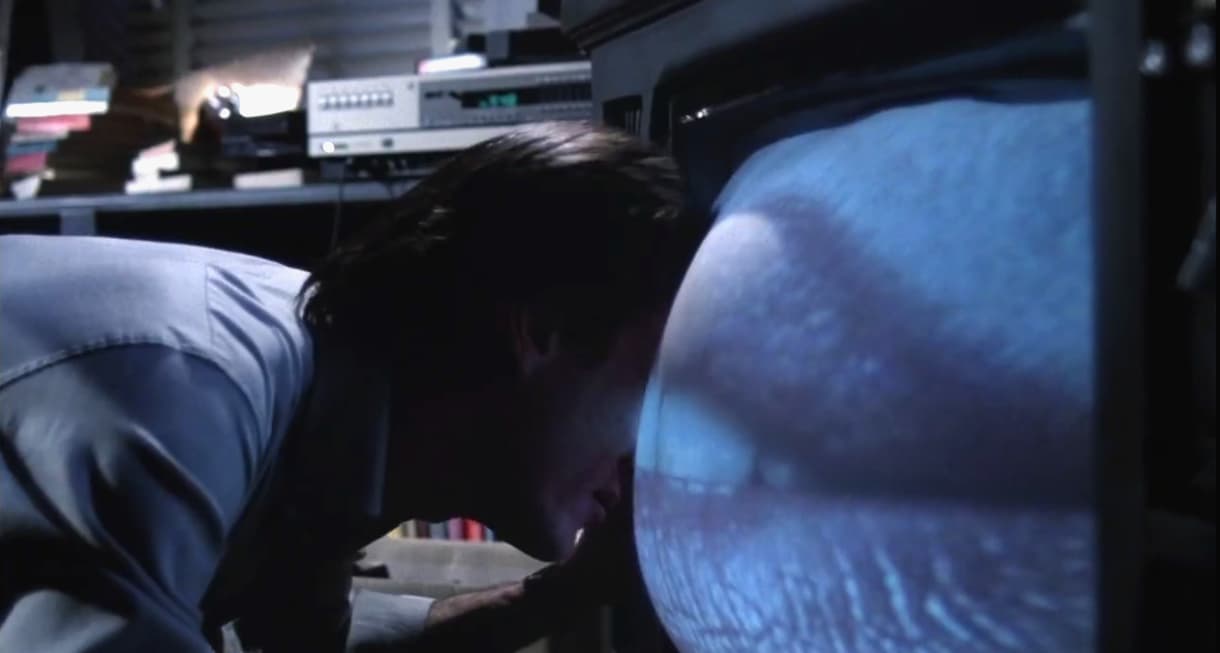 Max Renn starts getting physical with his TV set in Videodrome (1983), Universal Pictures
