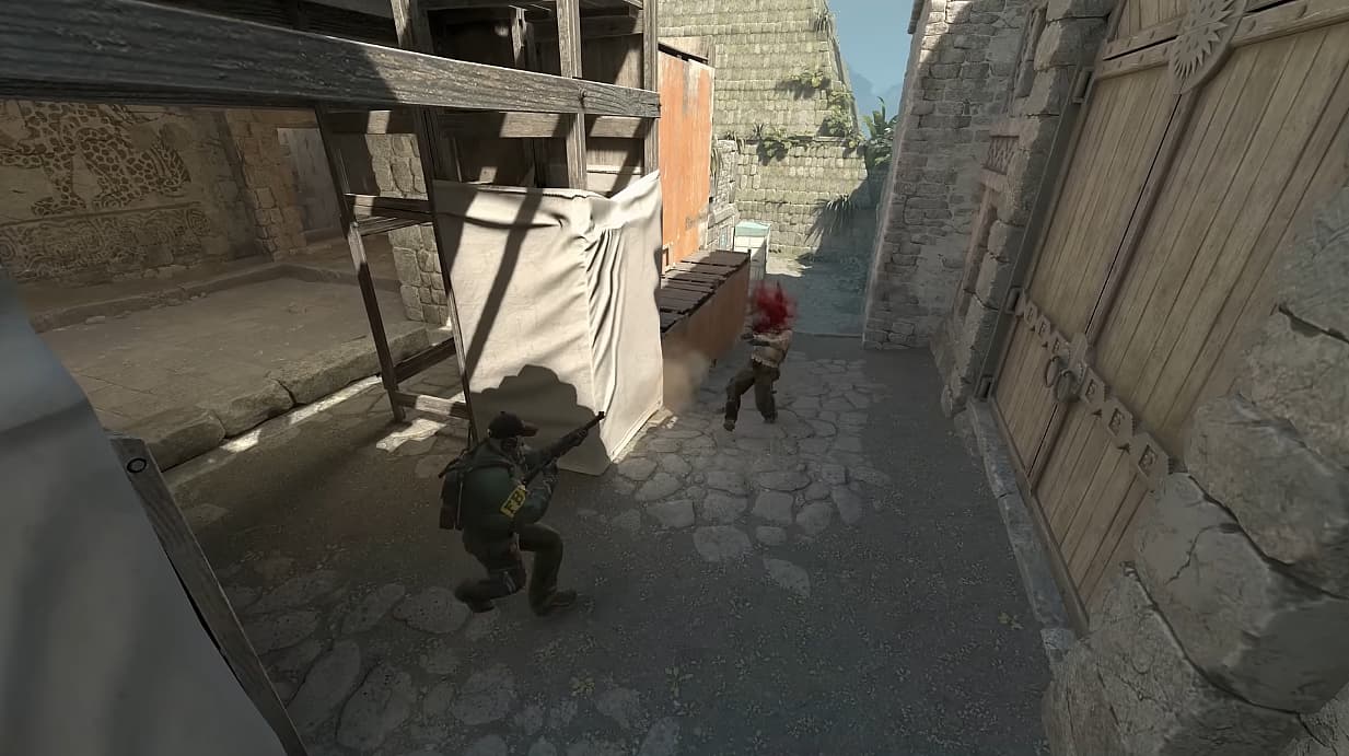 Two players meet in Counter-Strike 2 (Valve), one taking shotgun blast