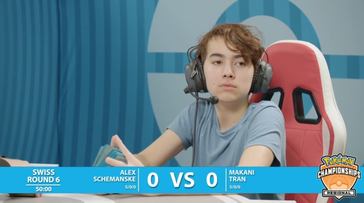 Makani Tran looks out at the crowd as he shuffles his opponent's deck via TCG Day 1 | 2023 Pokémon Charlotte Regional Championships, PokemonTCG Twitch