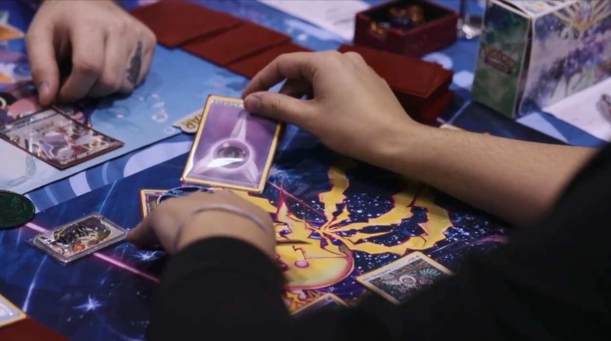 A Pokémon Trading Card Game players attaches a Psychic Energy card to their Pokémon via TCG Day 1 | 2023 Pokémon Charlotte Regional Championships, PokemonTCG Twitch