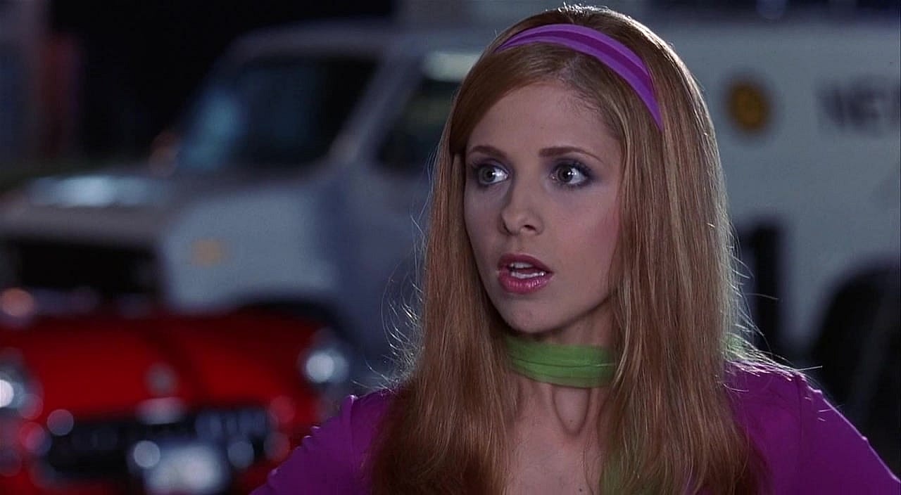 Daphne (Sarah Michelle Gellar) argues with the rest of the Mystery Gang in Scooby-Doo (2002), Warner Bros. Pictures