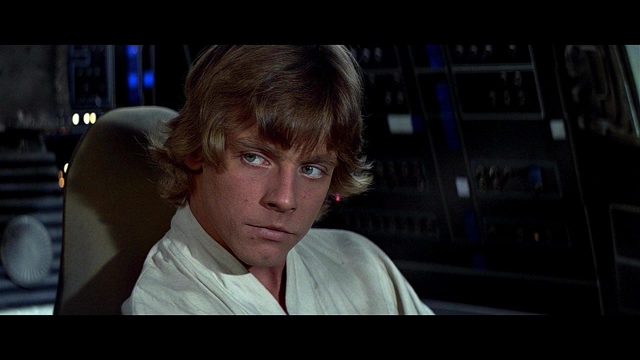 Luke Skywalker (Mark Hamill) learns a life lesson from Han Solo (Harrison Ford) in Star Wars: Episode IV - A New Hope (1977), Lucasfilm