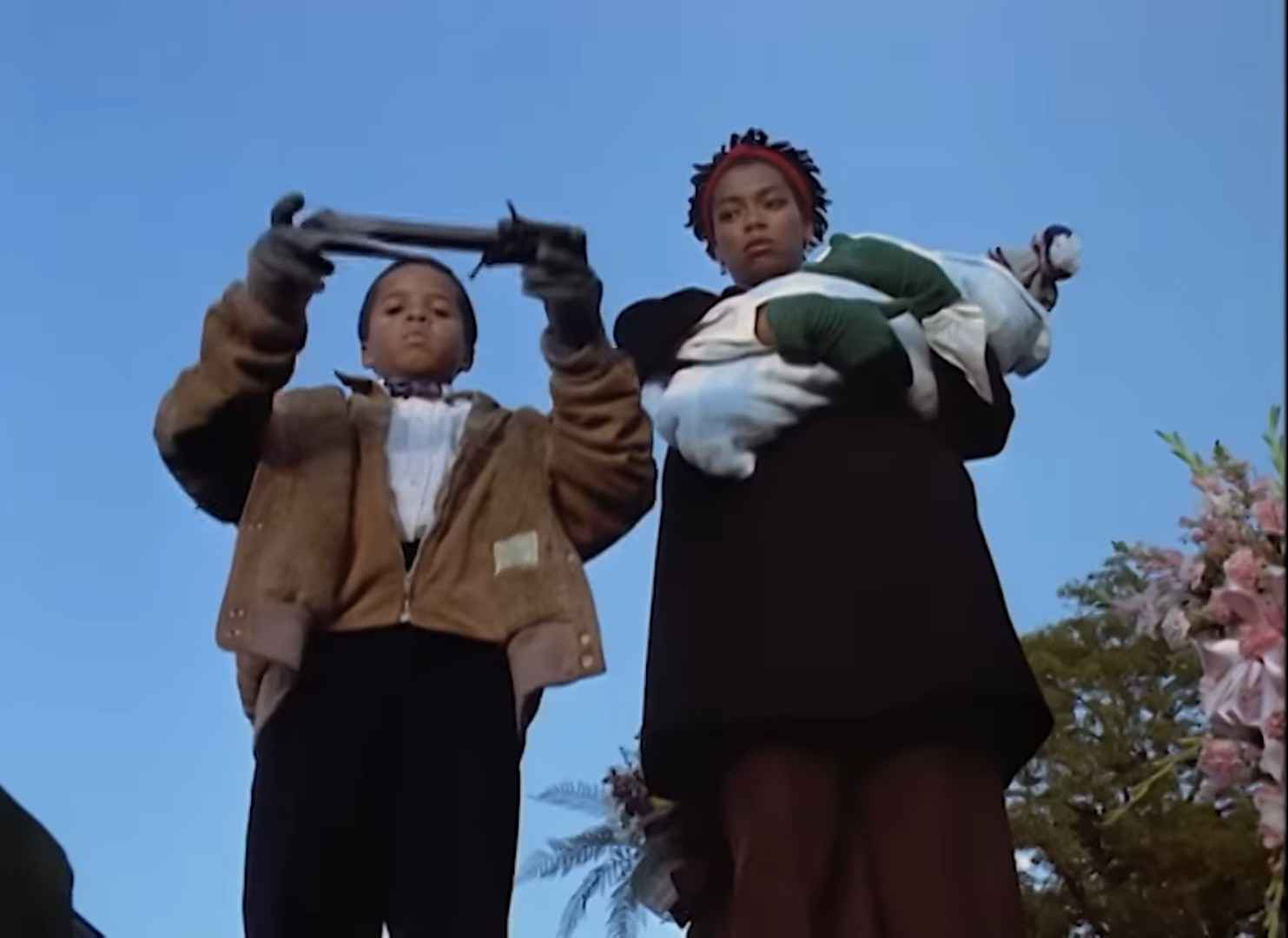 Jake (DeJuan Guy) and Anne-Marie (Vanessa Estelle Williams) pay their final respects, and leave a going away present for the departed. From Candyman (1992) TriStar Pictures. Image courtesy of Fear: The Home Of Horror