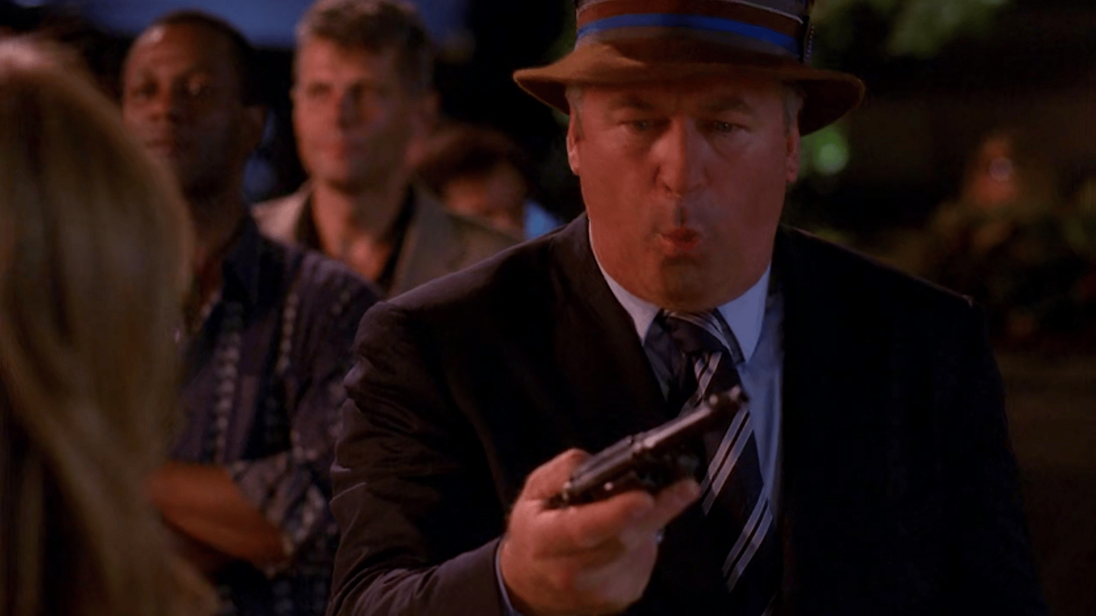 Jack Donaghy (Alec Baldwin) is surprised to find himself in possession of a gun in 30 Rock Season 3 Episode 3 "The One with the Cast of Night Court" (2008), NBC