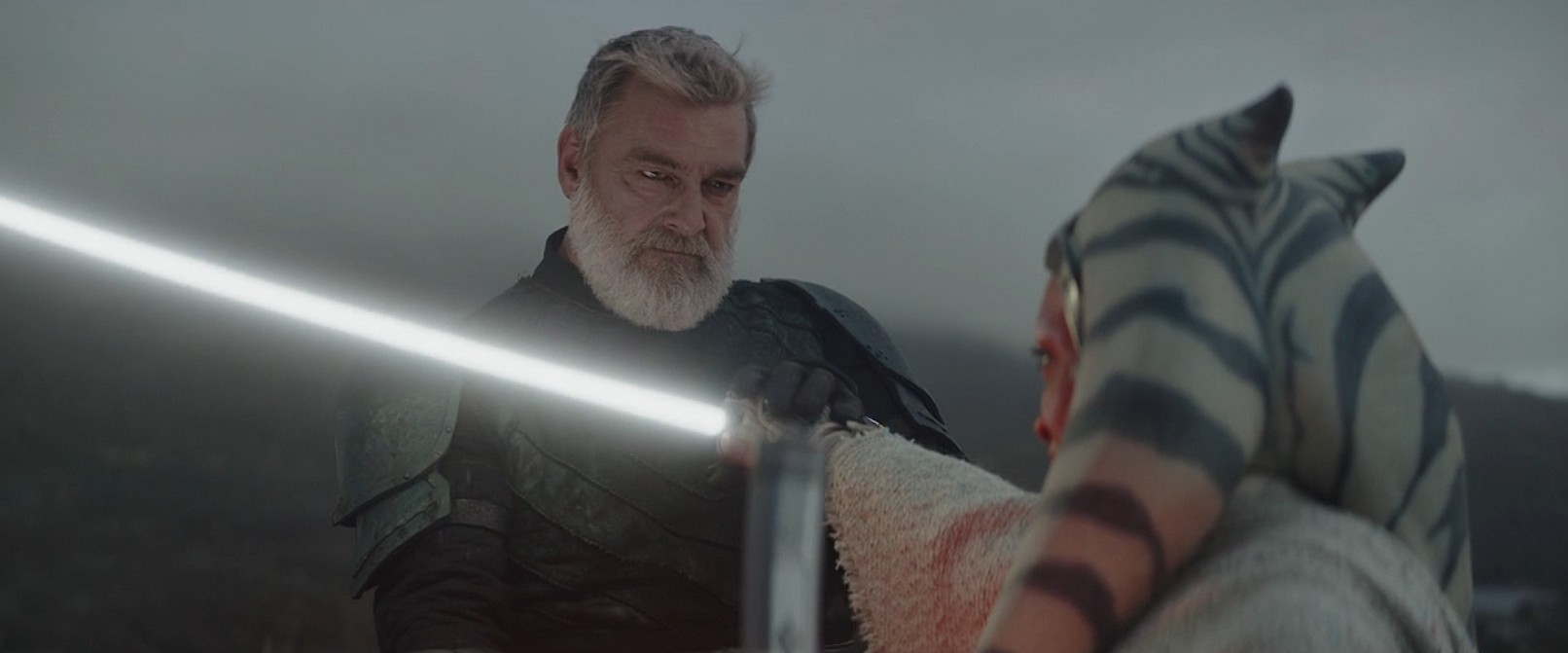 Ray Stevenson as Baylan Skoll parries an attack from Rosario Dawson as Ahsoka Tano (2023), Lucasfilm