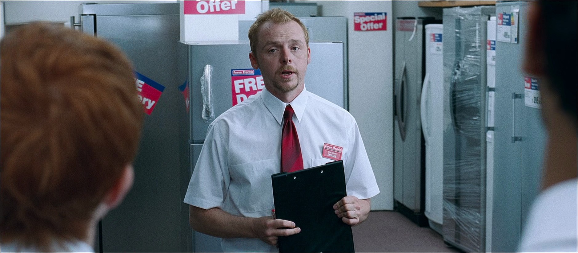 Shaun (Simon Pegg) readies up for another day of work in Shaun of the Dead (2004), Universal Pictures