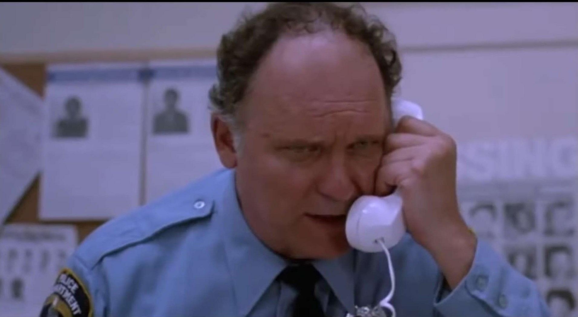 Officer Mooney (John Vernon) reaching boiling point with kids' pranks in Killer Klowns From Outer