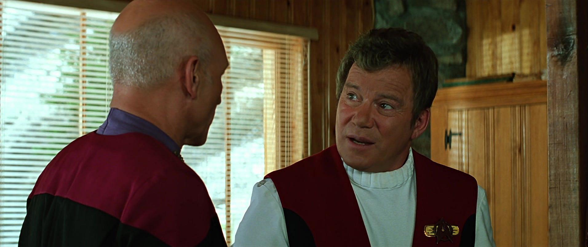 Captain Kirk (William Shatner) explains dissatisfaction to Captain Picard (Patrick Stewart) in Star