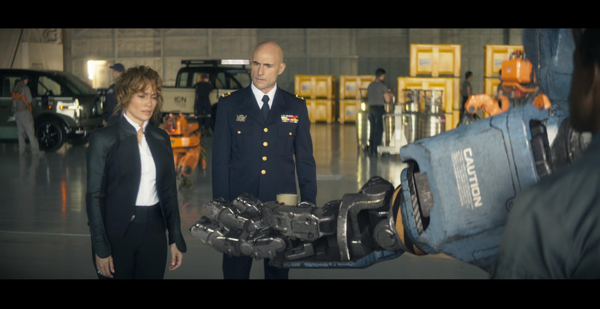 Zoe (Zoe Boyle) offers Agent Shepherd (Jennifer Lopez) a coffee in Atlas (2024), Netflix
